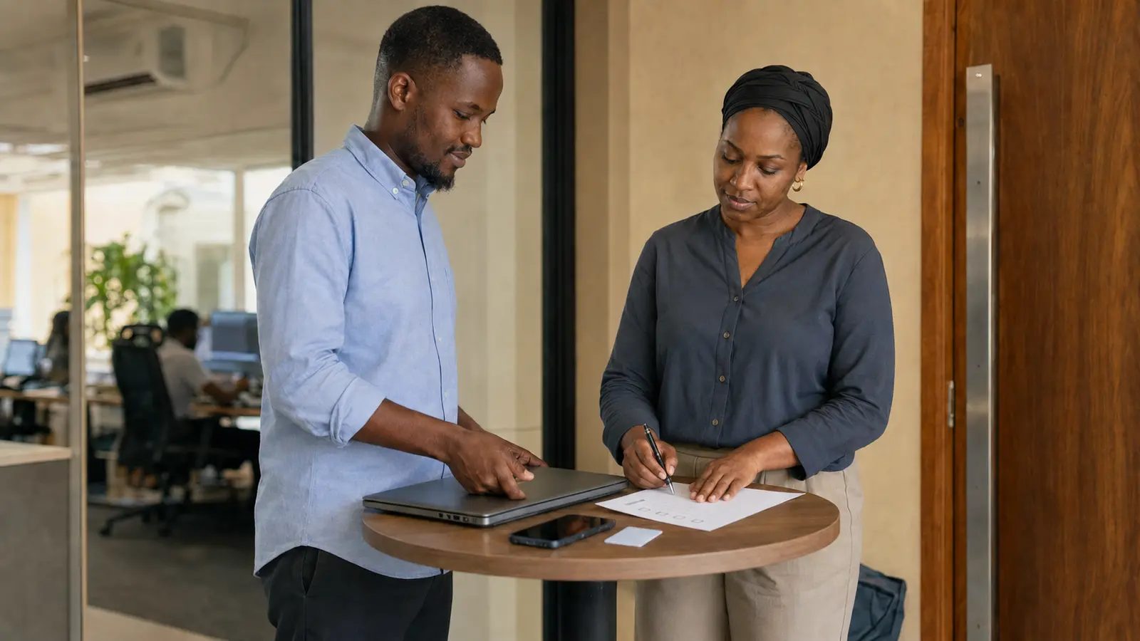 Manager completing a digital access handover with a departing employee